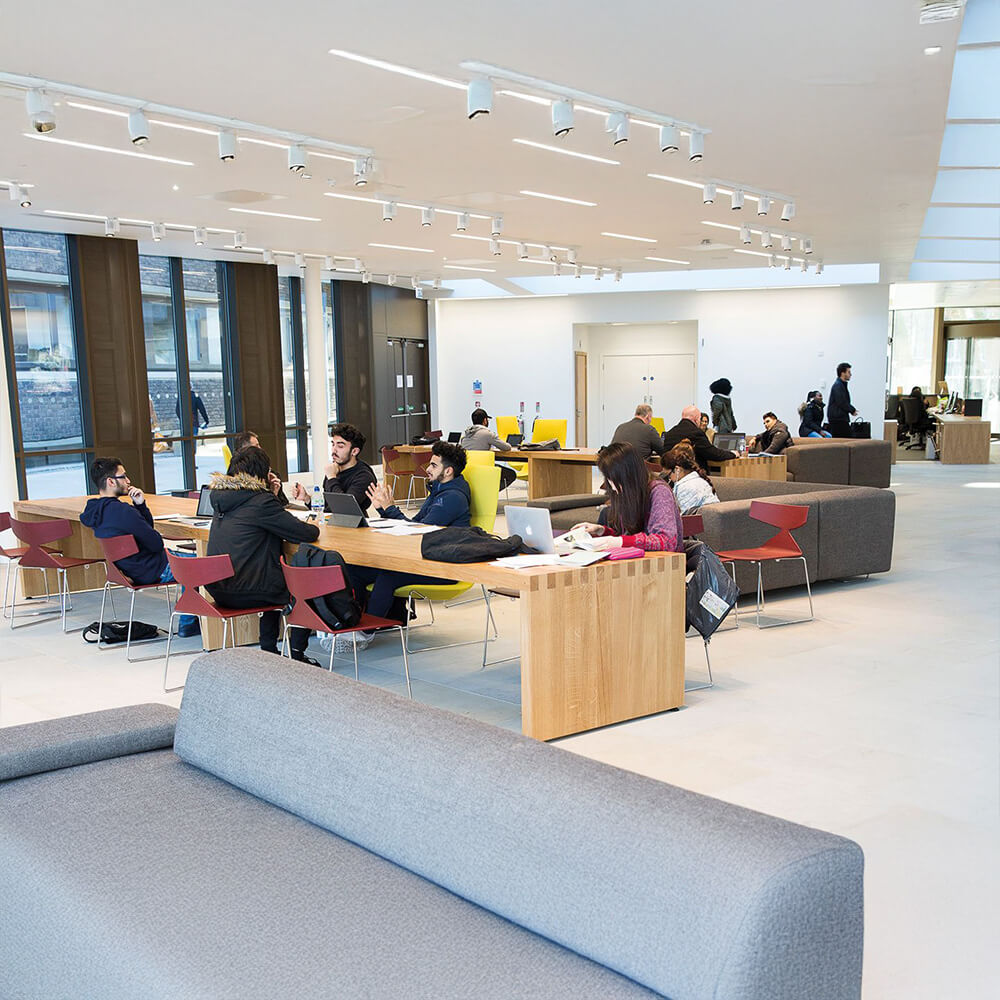 Students collaborate in a modern study space at St. George's University.